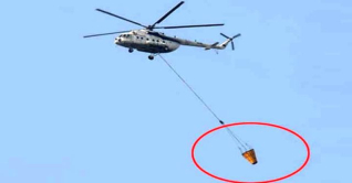 আগুন নিয়ন্ত্রণে হেলিকপ্টার থেকে ফেলা হচ্ছে পানি